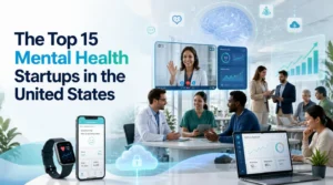 A modern blog banner titled "The Top 15 Mental Health Startups in the United States" featuring a diverse team of healthcare professionals and startup founders collaborating in a bright office. The image includes a teletherapy video call, a mental wellness mobile app, a wearable health tracker, a digital brain graphic, analytics dashboards, cloud technology, and business growth charts representing innovation in mental healthcare.